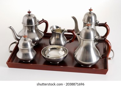 Silver Tea And Coffe Pots Set On A Dark Wood Tray, Isolated