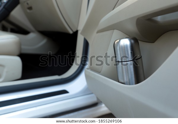 Silver thermos\
in door storage pocket inside\
car