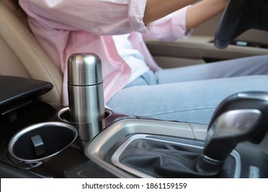 Silver Thermos In Holder Inside Of Car