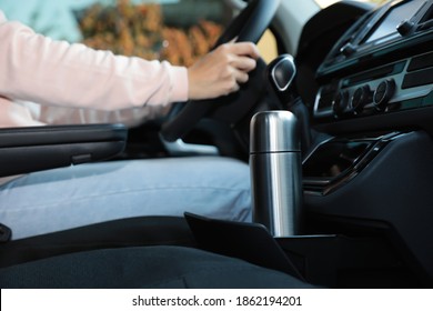 Silver Thermos In Holder Inside Of Car