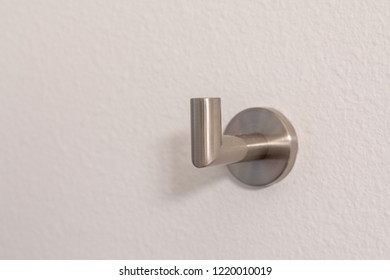 Silver Towel Hook On A White Wall