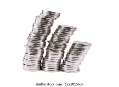 Silver Towers Made Out Of Coins Isolated On White