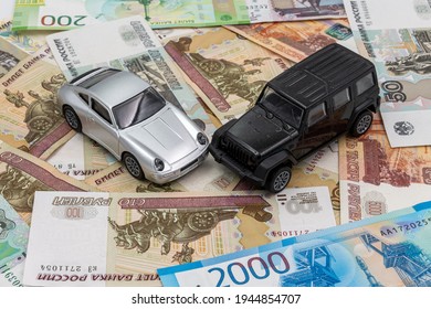 Silver And Silver Toy Cars Crush Accident With Russian Money (rubles). Rent, Buy, Insurance Or Crush Car Concept