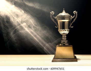 silver trophy placed on wooden table with dark background copy space ready for your design win concept.