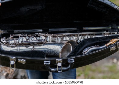 The Silver Vintage Sax In The Case Outdoors