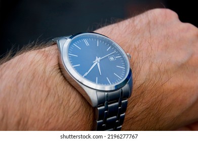 Silver Watch On Man's Hand.