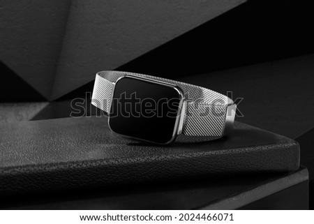 silver watchband smart watch on black background
