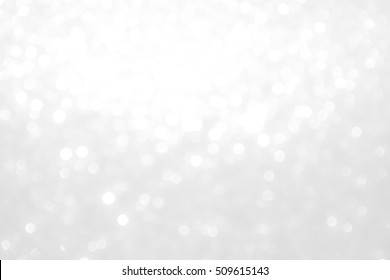 silver and white bokeh lights defocused. abstract background.
