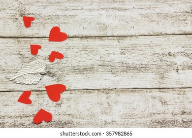 Silver wings and red hearts