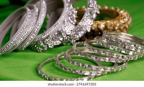 silver-plated bangle bracelets, often studded with American Diamonds or cubic zirconia, similar to those offered by brands like Rubans or NVR..JPG