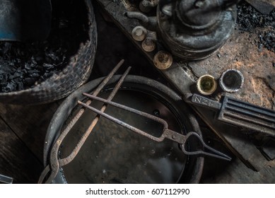 At silversmith's workshop with traditional tools