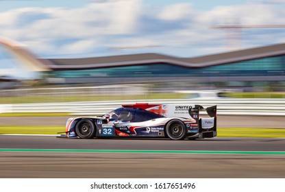 Silverstone Circuit, England, 31 Aug 2019. United Autosports LMP2 speeds down Vale with the Silverstone Wing in the background. ELMS 4 Hours of Silverstone 2019