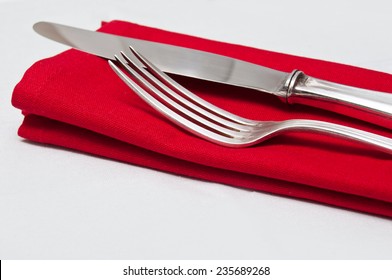 silverware closeup on red napkin - Powered by Shutterstock