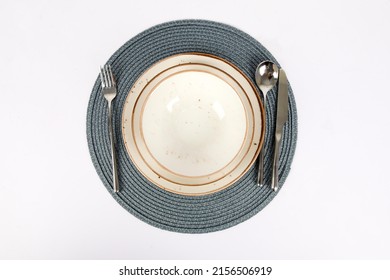 silverware or flatware set and plates isolated on white background.Part of a stylish table decoration with a plate and a knife.