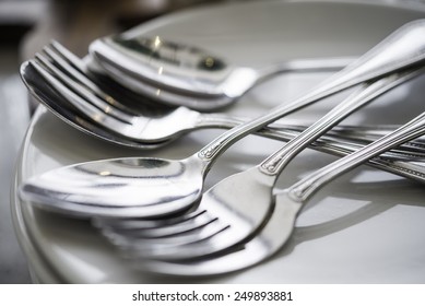 Silverware Or Flatware Set And Plates. On Table Dinner