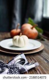 Silverware On Thanksgiving Day Holiday Table Buffalo Check Napkin Tied With Black And White Bow. Selective Focus On For And Spoon With Blurred Foreground And Background. 