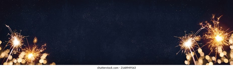 Silvester, New Year's Eve 2023 Party, New year, Fireworks, Firework holiday celebration background banner panorama long greeting card - Sparklers and bokeh lights on dark blue night sky