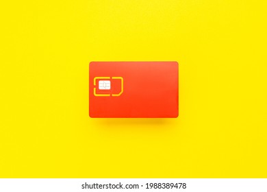 sim card for mobile phone isolated on yellow background. 4G sim card for smartphone cut out.