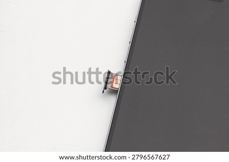 SIM Card Tray Ejecting from Smartphone Side View