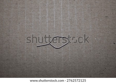 SIM ejector or SIM ejector pin. This tool is a small metal pin specifically designed to pierce the small hole in the SIM tray so that the card slot.