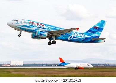 Simferopol Airport September 11 2021 Vq-bas Airbus A319 Rossiya Airlines Landing Over Azimuth Airlines Ssj 100 Plane Zenith Football Team Livery