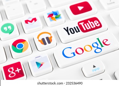 SIMFEROPOL, RUSSIA - NOVEMBER 22, 2014: Most popular logotypes of Google applications printed on sticker and placed on a buttons of keyboard. Included Youtube, Gmail, Chrome, Play market and other