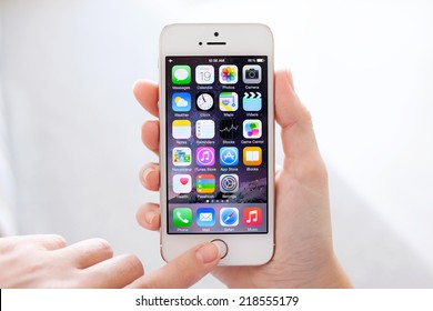 Simferopol, Russia - September 19, 2014: Apple iPhone 5S displaying iOS 8 homescreen. iOS 8 mobile operating system designed by Apple Inc. is an upcoming September 17, 2014.