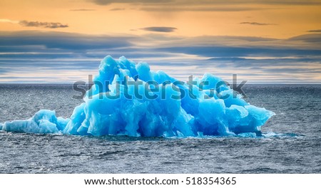 Similar to blue rose iceberg floating on Arctic ocean (fresh ice) offing. - Voyager: Wow, that's a lot of ice for whiskey! Freak of nature. - Remind you that 90 percent of iceberg is under water