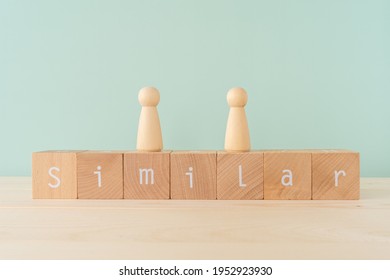 Similar; Seven wooden blocks with  "Similar" text of concept and two human toys. - Shutterstock ID 1952923930