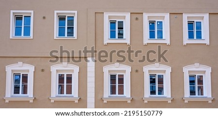 Simmetrical facade with white windows