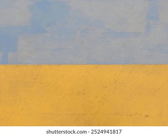 A simple abstract composition featuring two bold colors, yellow and blue, divided horizontally with minimal texture.