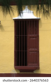 A simple architecture, with large windows and many colors to contrast with the bright light.