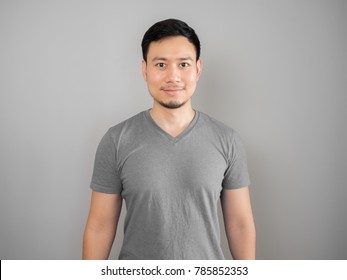 Simple Asian man in grey t-shirt.