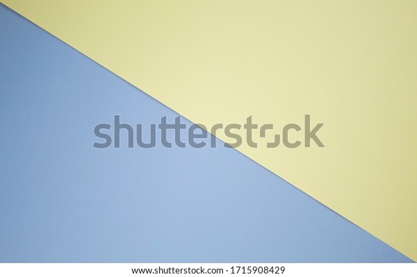 A simple background that is divided into two equal\
parts diagonally from left to right. Half of the background is\
light blue, the other half is light yellow. Concise business style.\
Field for text.