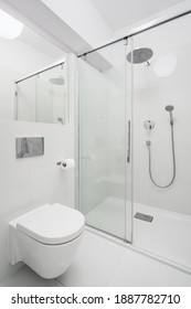 Simple Bathroom With Spacious Shower Area Behind Glass Sliding Door