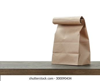 Simple Brown Paper Bag For Lunch Or Food On Wooden Table