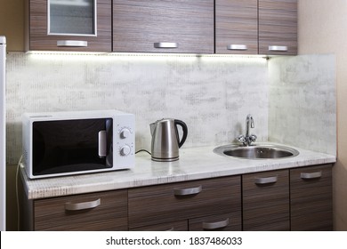 Simple, Cheap Kitchen In A Rented Apartment. Microwave, Kettle And Fridge.