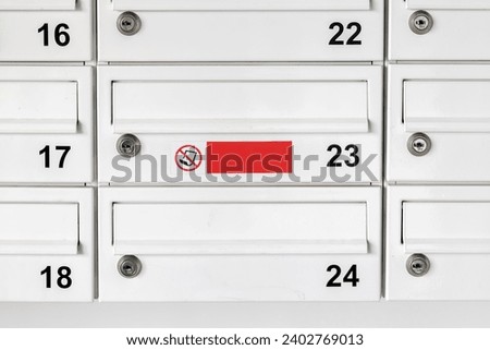 Simple communal letterboxes, post box letter boxes for flat apartments front view object detail closeup, nobody, no advertisements sticker label. Numbered apartment postbox up close, frontal shot