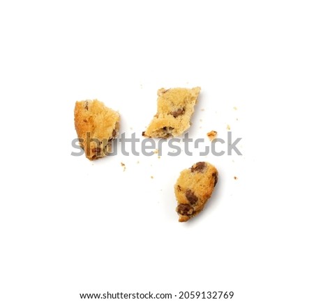 Simple crumbled cookie isolated. Broken oatmeal sugar bitten cookies, chocolate chip biscuit pieces. Round broken biscuit top view