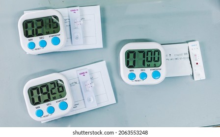 Simple digital timers set for the duration of PCR rapid tests to reveal results. At a small testing clinic or laboratory.