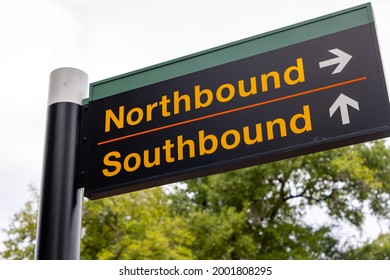 Simple directional sign pointing train passengers to northbound and southbound platforms at suburban commuter rail station - Powered by Shutterstock