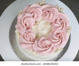 Simple elegant vanilla raspberry cake with buttercream icing