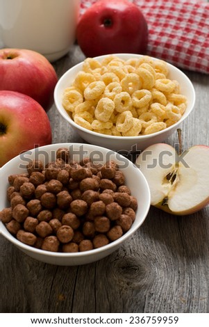 The simple food composition with apples and corn flacks