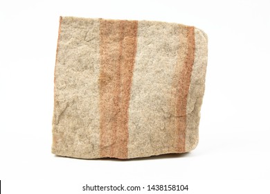 A Simple Image Of A Piece Of Sandstone Rock Isolated On A White Background.