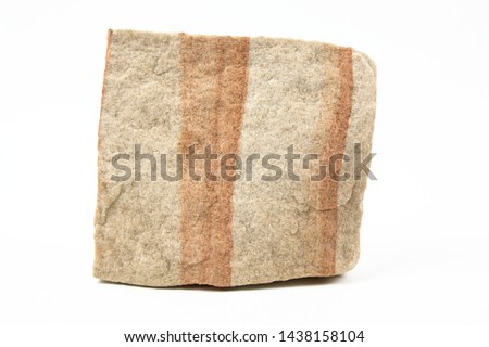 A simple image of a piece of sandstone rock isolated on a white background.