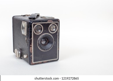 Simple and inexpensive Basic cardboard box camera with a simple meniscus lens isolated on white with shadow