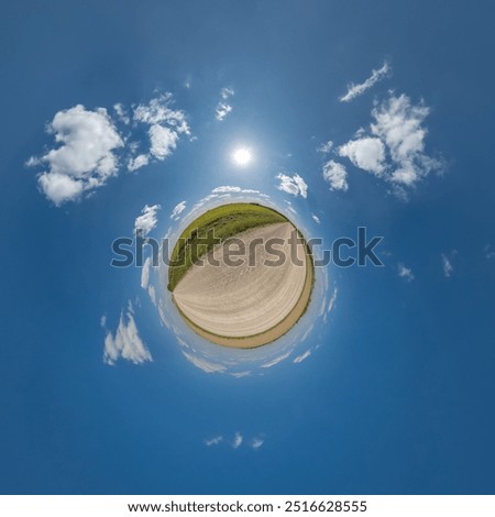 simple little tiny planet without buildings in blue sky with beautiful clouds. Transformation of spherical panorama 360 degrees. Spherical abstract aerial view. Curvature of space.