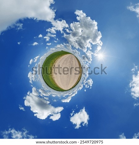 simple little tiny planet without buildings in blue sky with sun and beautiful clouds. Transformation of spherical panorama 360 degrees. Spherical abstract aerial view. Curvature of space.