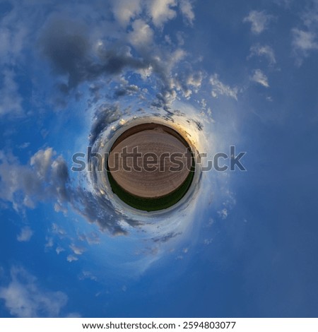simple little tiny planet without buildings in blue sky with sun and beautiful clouds. Transformation of spherical panorama 360 degrees. Spherical abstract aerial view. Curvature of space.