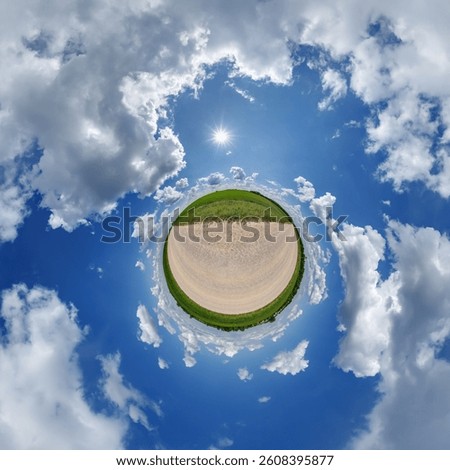 simple little tiny planet without buildings in blue sky with sun and beautiful clouds. Transformation of spherical panorama 360 degrees. Spherical abstract aerial view. Curvature of space.